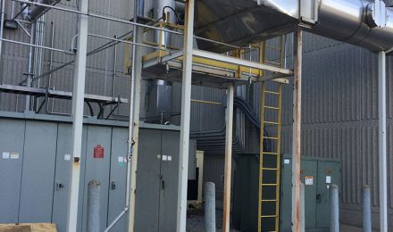 Fabricated stainless steel ductwork outside next to building