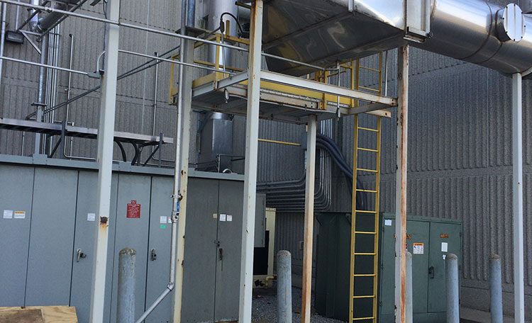 Fabricated stainless steel ductwork outside next to building